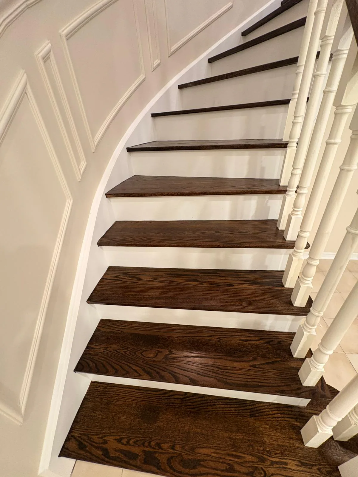 After — Curved staircase after detailed construction cleanup.